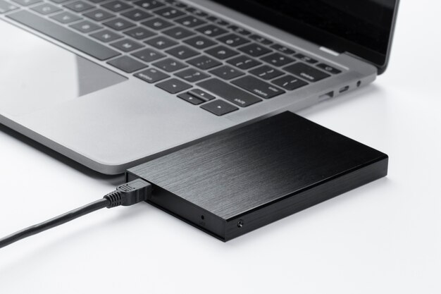 [fpdl.in]_high-angle-external-hard-disk-laptop-arrangement_23-2149417049_normal